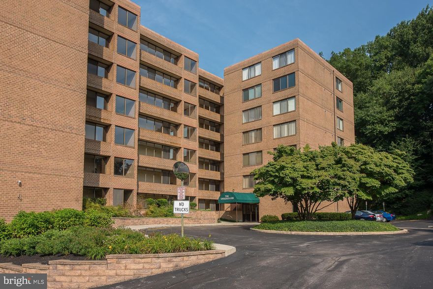 Welcome to Unit 1-G at the Greenhouse Condominium, ideally situated in the highly desirable Bala Cynwyd community. Nestled within a serene, park-like setting featuring mature trees, lush landscaping, and a tranquil stream, this move-in ready 2-bedroom, 2-bath residence offers the perfect blend of comfort, convenience, and natural beauty. This first-floor unit provides easy, stair-free access and features a bright, open-concept living and dining area filled with natural light and peaceful views. Sliding glass doors lead to a spacious enclosed patio overlooking a wooded area and creek—an ideal setting for relaxing or entertaining. The eat-in kitchen offers ample cabinet and counter space, perfect for everyday living. The primary suite boasts generous closet space and a private ensuite bath complete with tub, vanity, and tile flooring. A well-sized second bedroom offers flexibility for guests, a home office, or additional living space. Additional highlights include two large hall closets, a full hall bathroom, and a convenient in-unit laundry closet. The unit also comes with one deeded parking space located close to the building for added ease. Residents of Greenhouse Condominium enjoy access to a community outdoor pool, enhancing the lifestyle experience during warmer months. Ideally located just minutes from the Cynwyd Heritage Trail, Center City, Manayunk, and major roadways including I-76, and situated within the award-winning Lower Merion School District, this is a wonderful place to call home.