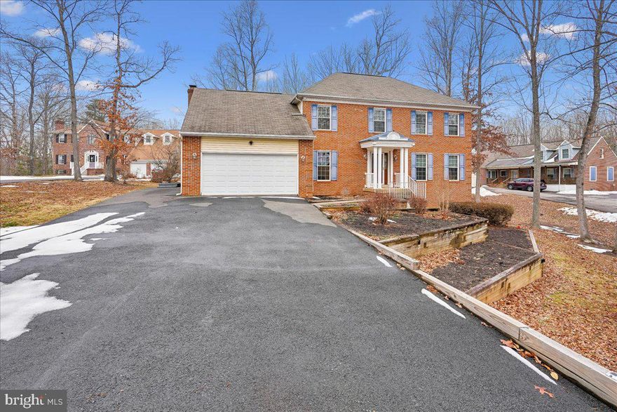 Spacious and full of potential, this home features three fully finished levels, updated bathrooms, hardwood floors, and a generous layout ready for its next owner to make it their own. The finished lower level offers flexible space with room for a kitchen, full bath, bedroom area, and living space, ideal for multi-generational living or possible rental use. Enjoy updated kitchen appliances, granite countertops, and a bright all-seasons room that opens to a deck, perfect for relaxing or entertaining. Conveniently located minutes from shopping, dining, and commuter routes. Being sold as-is, this is a great opportunity to customize a spacious home in a prime location. Welcome home!