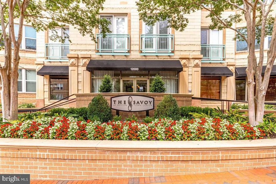 Welcome home to 12000 Market St #132 in the prestigious Savoy Condominium, nestled within Reston Town Centre. This home blends style and convenience, and elevates the experience of modern urban living. HVAC was replaced on May 2021 & Water Heater April of 2022.  Step into an inviting space adorned with Tile & rich hardwood floors that create an immediate sense of warmth and luxury. The open-concept design seamlessly connects the living, dining, and kitchen areas, forming a desire space that's perfect for relaxation or hosting gatherings. The kitchen is a perfect blend of functionality and sophistication, boasting  that provide ample space for meal preparation and entertainment.  This unit conveys two deeded parking spots.  The Savoy Condominium extends its offerings through an array of desirable amenities, adding a new dimension to your lifestyle. Stay active in the well-equipped fitness center, enjoy warm summer days by the pool, entertain friends in the game room, and feel secure in the access controlled environment this complex offers. Benefit from the unparalleled convenience of a location just moments away from the Metro station, providing swift access to the city and its offerings. As the day unfolds, explore the enticing variety of dining, shopping, and entertainment options that Reston Town Centre is celebrated for.