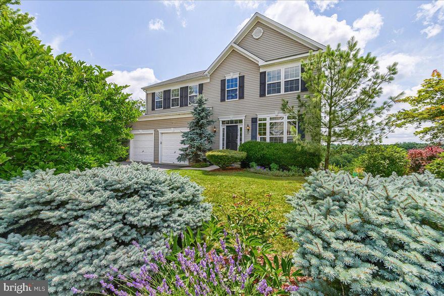 Welcome to this charming and meticulously maintained 4-bedroom, 2.5-bath Colonial home nestled on a quiet cul de sac street in the desirable Manchester Farms neighborhood.   As you step inside, you'll be greeted by the inviting main level, adorned with gleaming hardwood flooring. The eat-in kitchen is a chef's dream, boasting elegant Corian countertops that perfectly complement the sleek cabinetry and a large customized pantry system.  The adjacent dining room provides an ideal space for hosting formal gatherings, while the living room and family room offer cozy areas to relax and unwind.  
One of the highlights of this home is the delightful sunroom, flooded with natural light and featuring a glass/screen door with a convenient pet door that leads out to a composite deck. It's the perfect spot to enjoy your morning coffee or entertain guests while taking in the serene and private view.  The upper level is dedicated to rest and relaxation, with four generously sized bedrooms. The primary bedroom is a true sanctuary, complete with a luxurious en-suite bath featuring a soaking tub for ultimate relaxation and a separate shower. Three of the bedrooms boast walk-in closets, providing an abundance of storage space. 
 The laundry room is conveniently located on this level, along with an additional full bath, ensuring comfort and convenience for everyone in the household.  The basement is unfinished and offers endless possibilities for customization, with a walkout that leads to a charming bluestone patio, ideal for enjoying the surrounding natural beauty. A full bath rough-in is already in place, offering the potential for future expansion and added functionality.  Additional features of this remarkable home include crown molding in the family room and living room, ensuring a touch of elegance throughout. The refrigerator was recently replaced in 2023, while the washer/dryer and dishwasher were updated in 2022, providing modern convenience for the lucky new homeowners.  Situated on a generous .26-acre lot, the yard boasts natural landscaping, bountiful blueberry bushes, colorful flowers, and raised garden beds, offering a tranquil oasis for outdoor enthusiasts and green thumbs alike. The oversized two-car garage provides ample space for parking and storage.  Don't miss the opportunity to make this beautiful home your own. Schedule a showing today and experience the perfect blend of comfort, style, and functionality that this property has to offer!