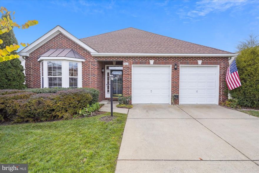 Spacious 2 level patio home features over 4,700 SF of refined living space.  The front entrance leads to a formal living room and dining room appointed with brand new hardwood flooring, architectural columns and crown molding.  You will love the updated kitchen with stainless steel appliances (5 yrs), gas cooking, under cabinet lighting, designer tile backsplash and Corian counter tops.  Large kitchen pantry and separate breakfast room.  Inviting family room with gas fireplace and French doors that lead to a big deck overlooking a grassy back yard and deep wooded common area.  Main level primary bedroom suite with tray ceiling, big walk-in closet with custom closet organizers plus a remodeled bathroom with jetted soaking tub for two, elegant tile work, double vanity and separate shower.  Main level laundry room with soaking tub and newer washer & dryer.  The huge walkout basement features a large rec room with patio door to the stone patio.  There is also a game room with an electric fireplace and walk-in closet.  The media room features built-in wall speakers.  This room can also double as a home office.  The lower level 4th bedroom has a walk-in closet and ensuite full bathroom.  Recessed lighting in all four rooms. Large unfinished storage room/workshop.  This home is equipped with a new $40,000 solar energy system that virtually eliminates the cost of electricity (installed 2022). Updated roof (4 yrs).  Enjoy a multitude of flowering perinnials that surround this home including 4 varieties of oriental pears, hydrangeas, roses, grape vines, herbs and red buds.  Custom built stone patio features a porch swing, garden fountain and handmade Portuguese tile mural.  Community amenities include a clubhouse with indoor heated pool, game room, party room, fully equipped fitness facility, tennis and putting green.