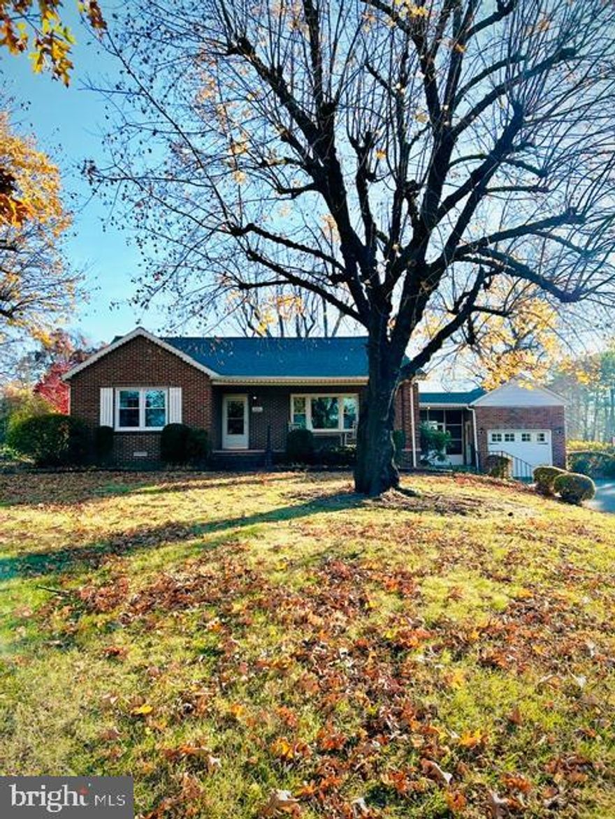 Welcome to 2211 Calvary Rd., a delightful single family home in Bel Air, built in 1952. The beautiful brick exterior complete with new roof, covered front porch, screened side porch and attached garage on 0.93 acres welcomes you at first glance. Step inside to a light filled living area boasting warmth and charm. A thoughtfully designed 1300 sq ft interior offers beautiful original hardwood floors, 3 bedrooms, 1 cozy remodeled bathroom, living room with brick wood burning fireplace with marble mantel, dining room, kitchen, finished basement with vintage 70's pool table and attached laundry/utility area with spacious storage. Each room feels welcoming and reflects the timeless appeal of a loved and well kept home. The generous yard with mature trees and beautiful azaleas is perfect for gardening and outdoor enjoyment. This home overlooks Cedar Lane park with gorgeous sunset views and is located with easy access to nearby amenities. Shopping, dining and close proximity to I-95 make day to day living convenient and enjoyable. If you're ready to experience the comfort of this inviting well built home that is move in ready, schedule a private tour today. This home is being sold AS IS.