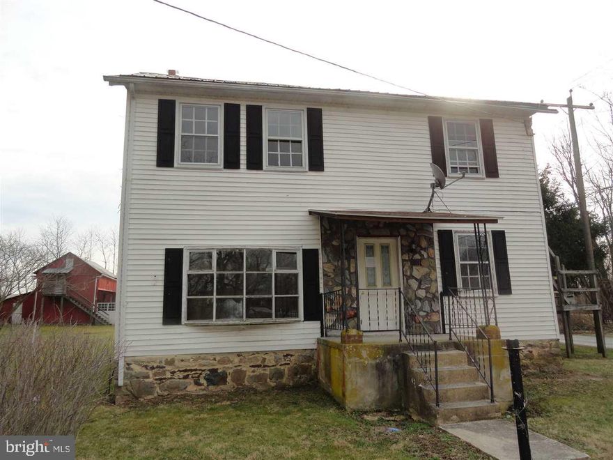 Large 2 story home on corner lot.  Several outbuilding including 2 story barn, storage area and more.  Home needs total Rehab.  Buyer pays both transfers.  Ask about FREE Title work.  Situated on corner lot.