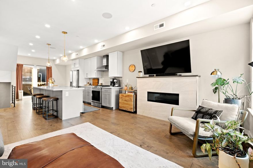 Location and style are beautifully showcased in this 3 bedroom, 3.5 bathroom Olde Kensington townhome. With front facing garage parking and tax abatement, this home built in 2020, provides convenience and comfort in one of the hottest neighborhoods in the city. Walking distance to world renowned restaurants, breweries, cafes and shopping, you'll be proud to bring guests to both your home and community. Speaking of guests, the third bedroom offers major privacy, storage and a beautiful en suite, located on its own floor. Additional storage space one floor below in the unfinished basement. The main living and kitchen is outfitted with high end appliances and finish selections. Quartz countertops, stainless steel appliances, and below counter microwave, complete this sleek and elegant kitchen. Your light filled dining space leads to your balcony, ready for grilling and entertaining. In the living room, cozy up to the modern gas fireplace, flanked by stunning windows which provide unobstructed exterior views, complete with sleek custom blinds for privacy. For convenience, there is a half bathroom on this main living level. Just upstairs, you'll find the owner suite with walk-in closet, and en-suite with double sinks and stunning glass enclosure shower with double shower heads. The secondary bedroom is complete with its own en-suite bathroom with tub. Don't miss the wet bar on your way up to enjoy the spacious roof deck. Whether hosting guests, or finding your own peaceful respite, 1738 N. Hancock is a true show stopper.