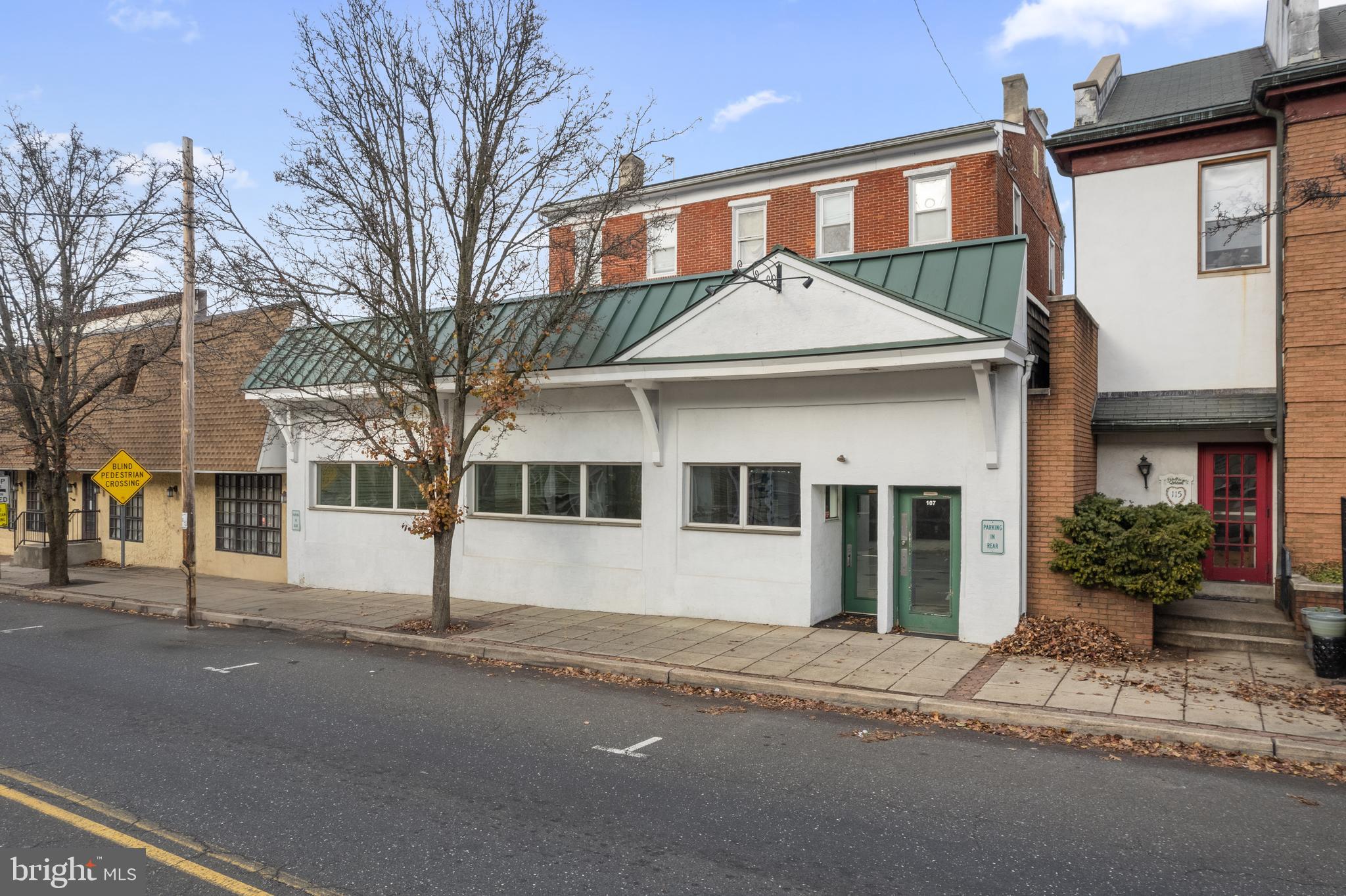 Prime Commercial Property with Residential Income in the Heart of North Wales, PA.
Welcome to 107 S Main Street, North Wales, PA, a fantastic mixed-use investment opportunity located in the heart of charming, walkable downtown North Wales. This property offers approx. 2,250 sq ft of commercial space (previously a thrift store and pharmacy - tenants just vacated) on the first floor along with two leased residential units upstairs — a perfect income-generating asset for any buyer.
Key Features:
1st Floor Commercial Space (vacant):
Approx. 2,250 sq ft of versatile space.
Features include a bathroom, kitchenette, and office/storage area in the back.
Open layout with both front and back entrances for convenience.
Ideal for retail, office, or specialty business use, boasting excellent visibility and access.
Residential Units:
Unit A: 3-bedroom, 2-bath leased unit.
Unit B: 1-bedroom, 1-bath leased unit.
Reliable rental income in place, providing immediate cash flow.
Parking: Over 20 private parking spaces located in the back of the building, with additional street parking available.
Location: Situated in the heart of North Wales Borough in Montgomery County, this property benefits from:
High pedestrian traffic and visibility.
Proximity to local businesses, restaurants, yoga studios, salons, and medical offices.
Convenient access to public transportation, including a nearby train station and bus stops.