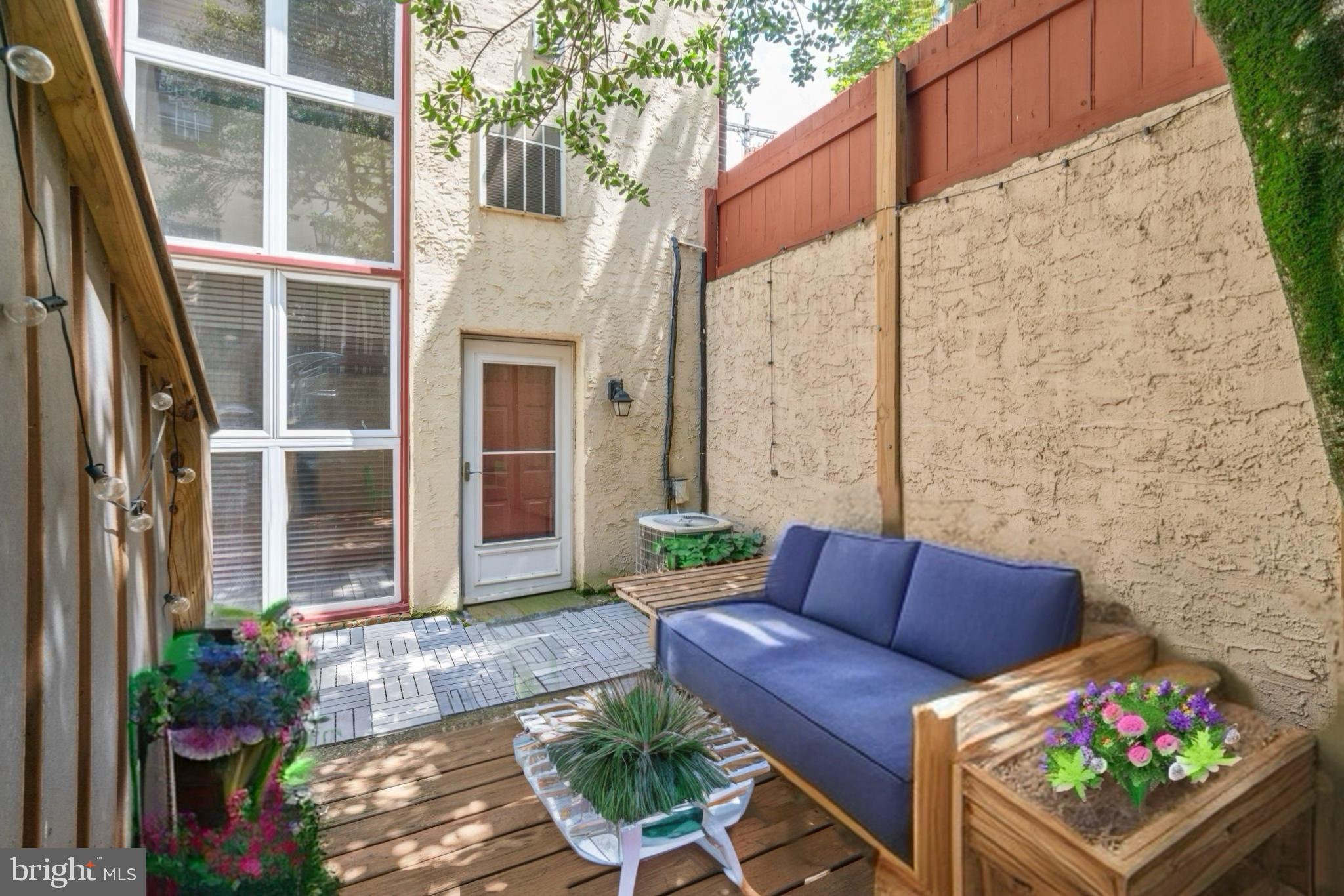 Nestled in one of Philadelphia’s favorite neighborhoods, Residence Fourteen at the Washington Mews Condominium is perfectly charming and offers the owner a wonderfully central location as well as a significant sense of privacy — a rare combination! The secure Lombard Street gate leads into the Washington Mews courtyard which is framed by lush layers of foliage and a brick walkway that leads to this property’s private outdoor oasis. The spacious patio welcomes you into the front outdoor space that is made private by side walls, wood fencing, and a shady tree — the perfect space to gather with friends for a BBQ and retreat after a day in the busy city! A wall of windows and a side door lead from the patio to the living room. The front living room is entirely inviting with its wide-plank hardwood flooring and brick hearth fireplace. The living room also offers a coat closet at the entryway, a large storage closet beneath the stairwell, and standalone storage between the dining area and kitchen. Space for a dining table is situated between the living room and kitchen on this open main level. A tiled kitchen at the back of the first floor features wooden cabinets as well as a 5-burner gas range, dishwasher, built-in microwave, and refrigerator. A closet off of the kitchen houses the front-loading Electrolux washer and dryer with additional space for household items. Follow the staircase up to the second floor. Turning right at the landing leads to the primary bedroom which offers park views. This bedroom is the larger of the two and features a closet with two bi-fold doors and two windows. A second bedroom is located across from the primary and offers a loft-style accommodation; this space is equally suited as a bedroom or an office. A tiled hallway bathroom featuring a tub/shower enclosure and pedestal sink as well as a separate hallway linen closet completes the second floor. Washington Mews is located a stone’s throw from multiple green spaces including the Seger Dog Park. It's also in the McCall School Catchment! In addition to the countless local cafes and eateries that surround the property, residents are a quick walk away from a number of local grocers including Whole Foods & ACME — as well as the Italian Market. WalkScore.com gives 1110 Lombard Street a 96 walk score and a 100 when it comes to public transportation! Parking options are ample with multiple garages nearby. Washington Mews has generous pet policies and allows owners to rent their condos out. We look forward to showing you all that Residence Fourteen has to offer! | Notes: Owner occupants can apply for a Homestead Exemption which may result in tax savings. The condo fee is collected on an annual basis. Disclaimer: Property taxes and square footage estimates should be verified by the buyer and/or their agent as these are not guaranteed by Compass or its salespersons.