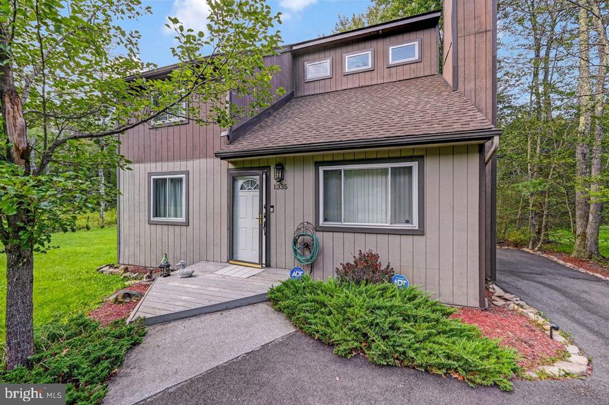 Come experience this contemporary home that invites warm comfortable settings. This home features 3 BRMS/1 BATH and a open concept living space. Relax by the fireplace or entertain in the spacious backyard by the fire pit. Deck features an electric awning that covers the rear. Home has access for EV hook up. Low dues community, great for full time or vacation living. Schedule your private showing today.