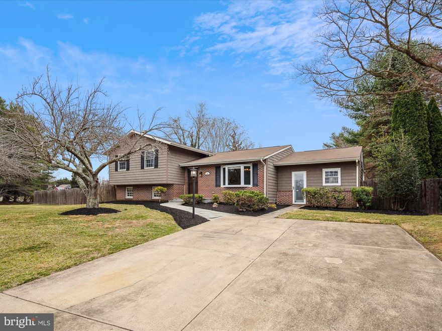 Welcome to your beautiful new home in Rolling Hills! Just minutes from the heart of Annapolis, this stunning corner lot has over an acre of beautiful, fully fenced, back yard (including a garden area). With gleaming hardwood floors throughout, this four-bedroom home has plenty of space for everyone. The granite kitchen, with a 5-burner propane stove, faces out to the stunning floor-to-ceiling windows overlooking your very own koi pond. Upstairs is a large primary suite with dual closets and private full bath, along with two sizable bedrooms and a full hall bath. Downstairs is an expansive family room complete with a cozy brick fireplace, perfect for movie nights! A fourth bedroom, laundry room, and tons of storage space complete the lower level. Enjoy the serenity and peace of your private oasis while you sip your morning beverage on the covered porch and take in all the natural light. Feel close to the action of Annapolis, with a quick commute to Route 97 and 50, but away from the hustle and bustle in your suburban retreat. Your perfect home awaits!