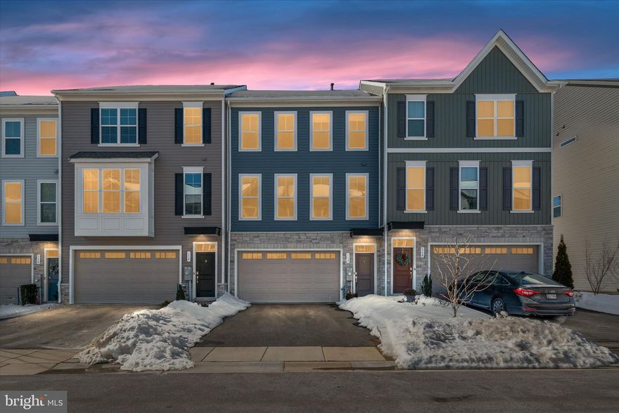 Welcome home to this beautifully maintained, four-year-young townhome thoughtfully designed with today’s lifestyle in mind. From top to bottom, this home offers both versatility and style. The lower level features a spacious flex area—perfect for a second family room, kids’ hangout, home office, gym, or whatever best suits your needs. A full bath on this level adds everyday convenience, along with sliding doors leading to a fully fenced backyard with a stone patio—an ideal space for relaxing or outdoor entertaining. An attached garage completes this level.  The second level truly serves as the heart of the home, showcasing a bright and open layout with seamless flow between the kitchen, dining, and family room. Expansive floor-to-ceiling windows flood the space with natural light, creating a warm and inviting atmosphere. The gourmet kitchen features a large center island, stainless steel appliances, abundant counter space, and generous storage—perfect for both everyday living and effortless entertaining. Upstairs, the spacious primary bedroom offers a private retreat with a walk-in closet and en-suite bath. Two additional well-sized bedrooms, a full hall bath, and a conveniently located laundry room complete the upper level. Neutral paint throughout, luxury plank flooring, and tasteful finishes make this home completely move-in ready.  Conveniently located with quick access to Route 97, commuting is simple and efficient. Enjoy the ease of being just minutes from shopping, grocery stores, and a variety of restaurants, offering the perfect balance of comfort, convenience, and lifestyle.  Come make this your new home!