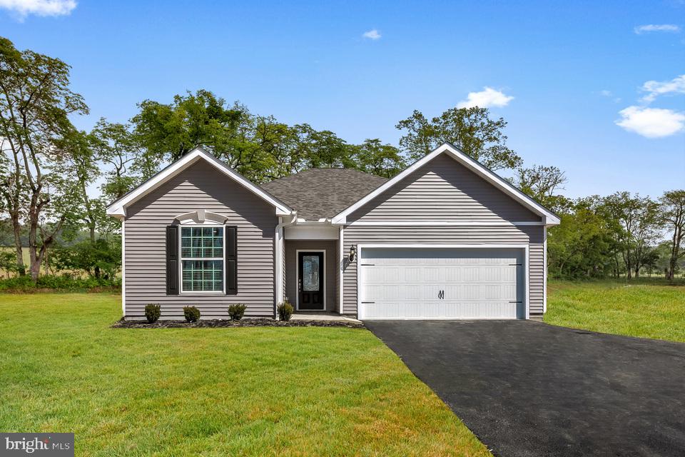 The beautiful single-story Martin plan from LGI Homes showcases an open floor plan with three bedrooms and two bathrooms. Hosting is made easy with a huge living room at the heart of the home, opening to the kitchen and dining room. Move-in ready, this home comes equipped with an upgraded kitchen featuring a full suite of Whirlpool brand appliances, polished granite countertops, modern white cabinets topped with crown molding, undermount kitchen sink, Moen brand faucets and much more! Homeowners will love the private master retreat showcasing a spacious bedroom, stunning bathroom and huge walk-in closet. Additional features included with this home are an automatic garage door opener, USB outlet in the kitchen and front yard landscaping.