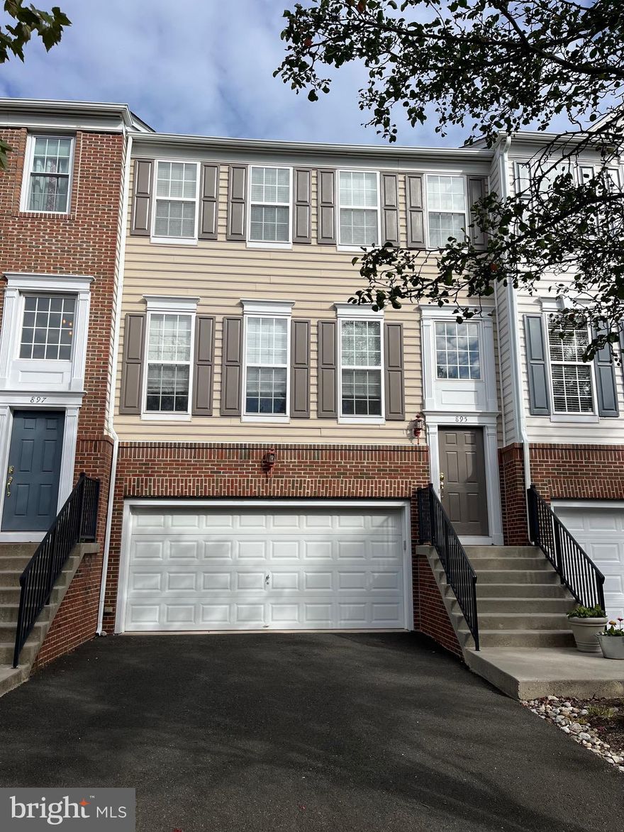 Spacious 3BR/2 Full BA/2 1/2BA townhome with open-concept kitchen, breakfast bar, and great room with fireplace. Dining area opens to deck overlooking open space. Sunny living room and powder room complete this level. Upstairs the main suite features jacuzzi tub, separate shower, and double vanity. Two additional bedrooms plus hall bath and laundry. Finished basement with yard access, powder room, and 2-car garage with storage. Prime location near shopping, dining, and turnpike access. Condo fee included—covers lawn care and snow removal.