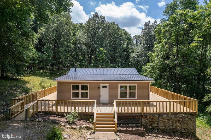 SECLUSION, PRIVACY, CONVENIENCE.  IF THESE ARE TERMS DESCRIBING YOUR SEARCH, THEN LOOK NO FURTHER.  THIS RECENTLY REMODELED HOME IS SITUATED IN THE WEST VIRGINIA HILLS WITHIN A 40 MINUTE DRIVE OF I-81 AT WINCHESTER, VA .  WHETHER LOOKING FOR A MOUNTAIN RETREAT, OR A PERMANENT PLACE TO CALL HOME, THIS PROPERTY WILL MEET THE NEEDS OF ANY AND ALL SEARCHING FOR A PEACEFUL EXISTENCE.  THE OPEN CONCEPT INTERIOR WITH MODERN FINISHING PROVIDES SPACIOUS LIVING AND NEW, LOW MAINTENANCE FEATURES.  THE ENORMOUS WRAP AROUND DECK SUPPLIES AN OUTDOOR SPACE TO RELAX AND ENJOY THE THE TYPE OF SCENIC BEAUTY THAT ONLY THE MOUNTAIN STATE CAN OFFER.  WITH THIS ONE YOU WILL BE GETTING A BIG BANG FOR YOUR BUCK!  DON'T HESITATE, OR IT MAY BE GONE BEFORE YOU KNOW IT!