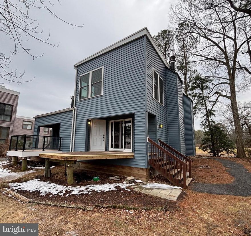 WOW!  Waterfront living in Ocean Pines at a fraction of the cost!  This condo in the Borderlinks is one of a rare few that come with its own private dock!  Canal and golf course views from every window in this unit!  All the heavy lifting is done or scheduled: New siding and new windows are already in the works!  The bulkhead is being replaced at this very moment!  New Roof in 2011; New Pilings completed within last 5-6 yrs; Additionally, all the mechanicals and appliances have been replaced within the last 4 yrs!  The hot water heater was replaced in '22; New HVAC plus WiFi thermostat in '23; both bathrooms renovated in '22; Electric Fireplace in '23; LVP Flooring was added in '23!  All you have to do is pick your paint and personalize!  Compare to any waterfront single family home in the Pines and you're saving 100's of thousands!  Don't let this opportunity pass you by!