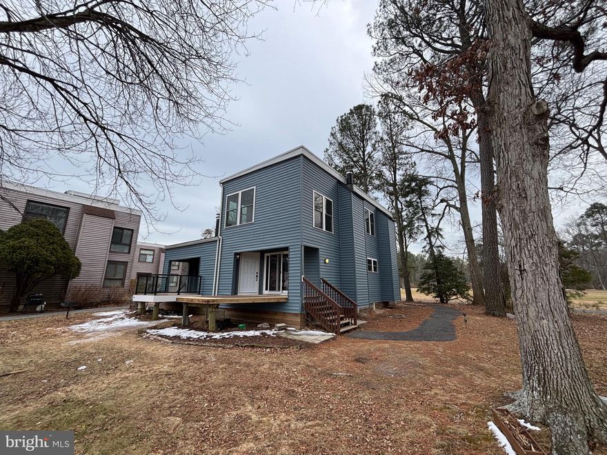 WOW!  Waterfront living in Ocean Pines at a fraction of the cost!  This condo in the Borderlinks is one of a rare few that come with its own private dock!  Canal and golf course views from every window in this unit!  All the heavy lifting is done or scheduled: New siding and new windows are already in the works!  The bulkhead is being replaced at this very moment!  New Roof in 2011; New Pilings completed within last 5-6 yrs; Additionally, all the mechanicals and appliances have been replaced within the last 4 yrs!  The hot water heater was replaced in '22; New HVAC plus WiFi thermostat in '23; both bathrooms renovated in '22; Electric Fireplace in '23; LVP Flooring was added in '23!  All you have to do is pick your paint and personalize!  Compare to any waterfront single family home in the Pines and you're saving 100's of thousands!  Don't let this opportunity pass you by!