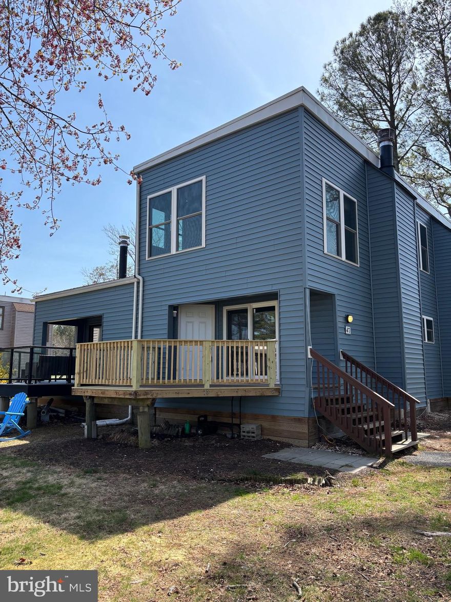 WOW!  Waterfront living in Ocean Pines at a fraction of the cost!  This condo in the Borderlinks is one of a rare few that come with its own private dock!  Canal and golf course views from every window in this unit!  All the heavy lifting is done or scheduled: New siding and new windows are already in the works!  The bulkhead is being replaced at this very moment!  New Roof in 2011; New Pilings completed within last 5-6 yrs; Additionally, all the mechanicals and appliances have been replaced within the last 4 yrs!  The hot water heater was replaced in '22; New HVAC plus WiFi thermostat in '23; both bathrooms renovated in '22; Electric Fireplace in '23; LVP Flooring was added in '23!  All you have to do is pick your paint and personalize!  Compare to any waterfront single family home in the Pines and you're saving 100's of thousands!  Don't let this opportunity pass you by!