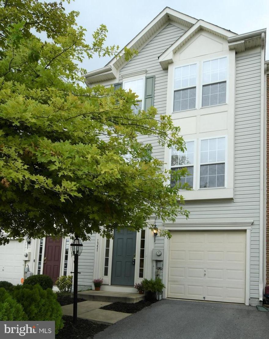 Move-In Ready & fresh paint! New dishwasher, fridge, lighting fixtures, carpet & blinds. Kitchen w/island leads to bright sunroom w/patio door opening to newly painted deck.  Lots of closet space. Lower level Washer & Dryer off rec room that leads to backyard. Nice landscaping.1-car gar. w/remote. Large Owner's Suite w/walk-in closet.  Close to Shopping, restaurants, Marc Train, recreation & parks