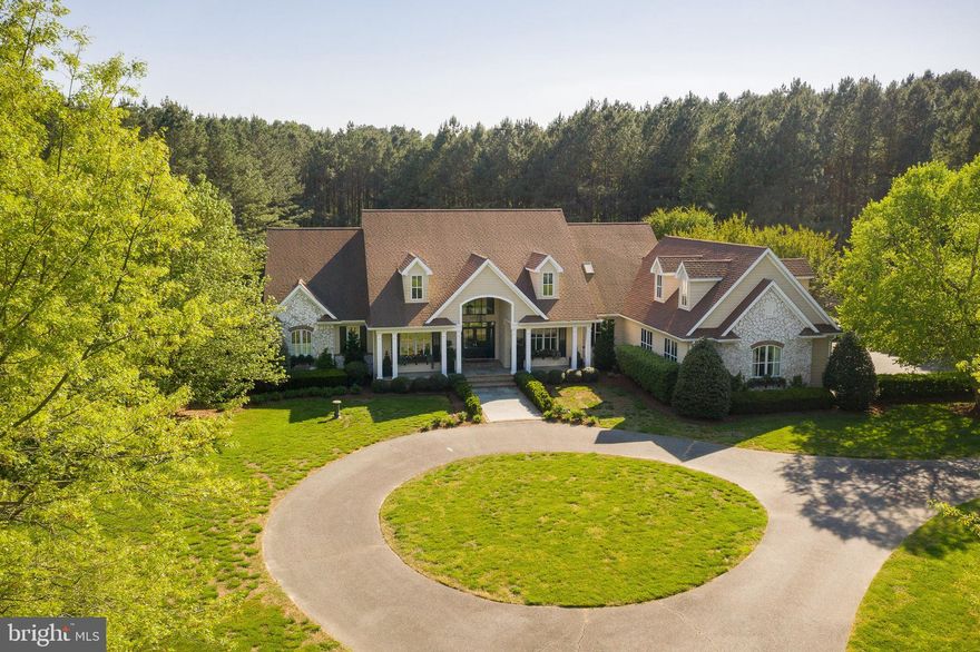 Not to be missed, this 6,230 +/- sf custom-built home on the Oxford Corridor has everything for the most discerning buyer.  Located just minutes from Historic downtown Easton and the Talbot Country Club, this stunning 5+/- acre tree-lined property has a saltwater in-ground pool and sports court. Entering the home, you are welcomed with a striking view of the picturesque backyard with elegant landscaping. The gorgeous interior has it all, with 4 bedrooms, 2 additional bonus rooms, and large recreation room the possibilities are endless. Exceptional details and millwork, a main-level master suite with two en-suite baths, a chef’s kitchen with two islands and high-end appliances, open floor plan, welcoming family room with cozy wood-burning fireplace, tall ceilings, and a luxurious living room with a dramatic two-story ceiling. Additional conveniences include geo-thermal HVAC, built-in barbecue, temperature controlled garage with studio and 3 car garage.