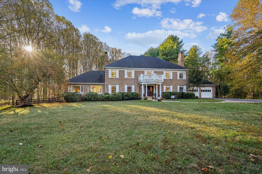 Custom Georgian four-sided brick colonial home set on 2.11 acres. With front portico, hip roof and refined millwork, this home offers stately curb appeal and enduring craftsmanship. Family room with a stone fireplace, panoramic views from the 3 sides of windows, newly finished hardwoods and french doors to deck. Formal living (with fireplace) and dining rooms open gracefully for entertaining. Large kitchen with granite counters, stainless appliances and casual dining area. 1st floor study.
Curved staircase leads to the hardwood upper level landing. Primary suite with massive walk-in closet, private bathroom with glass enclosure shower and study/nursery/office. 3 additional large bedrooms and hall full bath. Hardwoods in all bedrooms.
The finished walk-up lower level is designed for entertaining and play, featuring a full bar, home theatre, fireplace, built-ins and studio (potential for another bedroom).
Updates include roof (2012), gutters (2018), water heater (2023), and refinished hardwood floors (2025). With the possibility to add two additional bedrooms, this flexible layout adapts to evolving needs. 0.75-mile trail leads to the Triadelphia Reservoir and its scenic trails, wildlife (owls, eagles...) and water activities, while the Glenmont Metro (13 mi) connects effortlessly to D.C. and beyond. ICC interchange is just 10 miles away.

Enjoy the quiet elegance of a no-HOA enclave within Montgomery County’s coveted Sherwood school cluster (Sherwood ES 2.6 mi, Farquhar MS 3.0 mi, Sherwood HS 2.9 mi). Minutes to Olney Town Center and commuter routes MD-97 & MD-650, this residence balances estate-scale privacy with unmatched convenience.