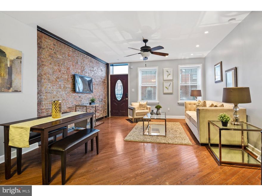 Welcome to 1036 S 5th St, a beautifully renovated Queen Village row home with amazing curb appeal, old world charm and all of the creature comforts and modern amenities you desire! Featuring 4 bedrooms, and 1.5 baths, and over 1400 sq ft, this home is perfect for the growing family or young professional looking for more than just a starter home. Enter into the first floor which boasts an open floorplan flooded with light, exposed brick, gorgeous solid hardwood floors and the beautiful modern kitchen with lots of counter space, stainless appliance package, double sink, and wine rack. Upstairs you will find 4 spacious bedrooms with hardwood floors and ample closet space. There is also a full bath on the 2nd floor. The basement is fully finished with half bath, laundry area, storage space, and mechanicals. Schedule your visit today!