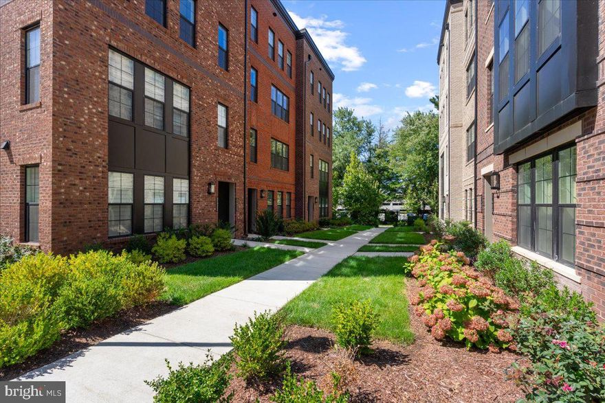 Welcome to this exceptionally luxe 3-bedroom, 2.5-bathroom residence in the coveted community of Union Park at McLean.  Nearly 1,588 square feet of finished living area over two levels. The unit features upgrades galore and designer finishes throughout that are sure to impress! The main level features an open layout with beautiful flooring, spacious dining/living area and gourmet kitchen – perfect for entertaining. The luxurious expanded kitchen features a large center island with waterfall edges, quartz counters & backsplash, and modern cabinets to the ceiling. The main level also features a powder room and direct access to the garage. The upper-level includes 3 bedrooms, 2 full baths, and a spacious laundry room with additional built-in cabinetry. The primary suite features a box up ceiling, walk-in closet, and luxury bathroom with frameless shower, tile to the ceiling, and dual vanity sinks. The spacious secondary bedrooms are adjacent to the upgraded hall bath and across from the oversized laundry room. Conveniently located near Tysons Galleria, subway stations, public transit, parks, and dining, this home offers the perfect blend of luxury and convenience. Don't miss the opportunity to make this exceptional property your own!