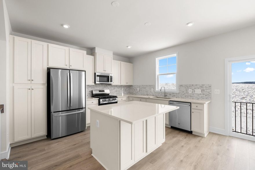 Say hello to your new home! This brand-new END UNIT TOWNHOME is ready for you to move in IMMEDIATELY! Step into contemporary luxury with the captivating SUGARLOAF floorplan by Van Metre Homes at LAKE FREDERICK. Spanning 2,124 finished square feet across three meticulously crafted levels, this exquisite townhome offers an unparalleled blend of style, comfort, and convenience. Boasting three bedrooms, three full and one half bathrooms, and a convenient 1-car front load garage, this residence is designed to exceed expectations at every turn. As you step inside, you're greeted by a meticulously crafted living space adorned with 9' ceilings, where the main level showcases a sprawling great room and dining area, seamlessly connected to a captivating kitchen featuring a central island, upgraded cabinets, tile backsplash, quartz countertops, and luxury vinyl plank flooring – the epitome of modern elegance and functionality. Venture to the upper level and discover a haven of relaxation in the impressive primary suite, complete with a generous walk-in closet and a luxurious 4-piece bathroom boasting double sinks and a frameless shower with a built-in seat – the perfect retreat after a long day. This level also hosts two additional bedrooms, another full bath, and a convenient upstairs laundry room, offering unparalleled convenience and comfort. Venture to the ground level and find a versatile multipurpose rec room and yet another full bath, providing ample space for relaxation and entertainment, with easy access to the private rear backyard, ideal for outdoor gatherings and leisure. Being a new build, your home is constructed to the highest energy efficiency standards, comes with a post-settlement warranty, and has never been lived in before! Don't miss out on this incredible opportunity to own a home that seamlessly combines modern luxury, thoughtful design, and a prime location, all at an unbeatable price. Schedule your appointment today! ----- Discover Lake Frederick, a charming community tucked in the serene Shenandoah Valley between Winchester and Front Royal. With its selection of townhomes and villas, Lake Frederick creates a perfect harmony between easy access to the great outdoors and a laid-back lifestyle centered around enjoying time with friends and having fun. With breathtaking mountain views just outside your door, this community boasts outstanding lifestyle amenities, including an award-winning farm-to-table restaurant, a community pool and clubhouse, tot lots, and miles of walking trails. End your days with family and friends while watching the sun set over the Blue Ridge Mountains. Moreover, Lake Frederick is conveniently located minutes away from major interstates like I-66 and I-81, ensuring seamless connectivity to the region. Embrace the sun-drenched life and the joys of natural beauty at Lake Frederick, where an exceptional community experience awaits. ----- Take advantage of closing cost assistance by choosing Intercoastal Mortgage and Walker Title. ----- Other homes sites and delivery dates may be available. ----- Pricing, incentives, and homesite availability are subject to change. Photos are used for illustrative purposes only. For details,  please consult the Community Experience Team.