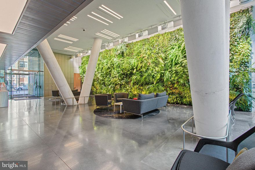 Distinguished by its exceptional layout and bespoke finishes, Residence 56 at The Westlight presents a rare opportunity to own a meticulously crafted two-bedroom and den, three-bathroom residence in one of Washington, D.C.’s most coveted and amenity-rich buildings. This elegant offering combines contemporary design with timeless sophistication, featuring an exceptional layout curated for both gracious living and effortless entertaining.
A long, gallery-style entryway welcomes you into the residence, setting the tone with high ceilings, recessed lighting, and generous closet space. Beyond the foyer, the home opens to an expansive layout where floor-to-ceiling windows bathe the interiors in natural light. The gourmet kitchen is appointed with custom cabinetry, a stylish backsplash, and suite of stainless steel appliances. A dedicated living area off the dining space features a flexible setting for relaxation or formal entertaining.
The primary suite offers a serene private retreat, complete with oversized windows, a walk-in closet, and a spa-inspired bathroom featuring a double vanity, frameless glass shower, and finely crafted cabinetry. The second bedroom is generously scaled and appointed with generous closets and an elegant en-suite bathroom with refined finishes. A third full bathroom provides comfort and convenience for guests. A dedicated den, ideally suited for use as a home office, library, or guest space, completes the residence, offering quiet separation.
Residents at The Westlight enjoy an unparalleled standard of service, including a 24-hour professional concierge, a doorman and porter, an on-site engineer, and a full-time building manager.
Amenities are equally distinguished, with a heated 25-meter rooftop pool offering panoramic views of the city, an expansive sundeck surrounded by manicured green spaces and private grilling terraces, a state-of-the-art fitness center, and an elegantly appointed clubroom. Located in the heart of Washington’s prestigious West End neighborhood, The Westlight places you at the crossroads of culture, convenience, and luxury. This enclave offers immediate access to the historic character of Georgetown, the vibrant pulse of Dupont Circle, and the institutional heart of downtown Washington. With proximity to the Foggy Bottom and Dupont Circle Metro stations, as well as easy access to the natural beauty of Rock Creek Park and the Georgetown Waterfront, life at The Westlight offers an incomparable blend of cosmopolitan energy and serene sophistication.