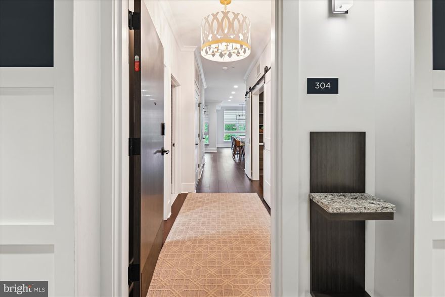 Custom Luxury in Downtown Annapolis — Over 2,100 Sq Ft of High-End Living at West141

Welcome to Unit 304, the premier residence in the boutique West141 building and the only unit created by combining two original floor plans into one expansive home. With over 2,100 square feet of thoughtfully designed space, this is downtown Annapolis condo living at its most refined.

Originally configured as a 3-bedroom, 3-bath layout, this home has been expertly redesigned to enhance both style and function. The spacious primary suite features its own private balcony, a seating area, a spa-inspired bath with double vanity, soaking tub, and oversized walk-in shower, and a large walk-in closet with custom California Closet built-ins. The second bedroom includes a private ensuite bath, perfect for guests. The third bedroom has been transformed into a high-end office with over $17,000 in custom cabinetry, shelving, and a built-in desk.

Off the main living area, a flexible bonus space provides the perfect zone for a home gym, reading lounge, or guest accommodations with a sleeper sofa or Murphy bed. And for any additional guests, the luxury Graduate Hotel is located directly across the street.

The kitchen is a showstopper—featuring an oversized quartz island with bar seating, stainless steel appliances, crisp white cabinetry, and designer lighting—all opening to a sunlit living and dining area accented by shiplap walls and custom built-ins.

Stylish and functional upgrades include: over 2,100 sq ft of interior space • custom-built office • three California Closet systems  • remote-controlled motorized shades • two private balconies (one off kitchen/dining, one off primary suite) • spacious primary suite with spa-like bath and seating area • shiplap accent walls  • oversized kitchen island with quartz counters and bar seating • stainless appliances and shaker cabinetry • flexible bonus space for gym, guest, or den • second bedroom with private ensuite bath • separate laundry room with storage cabinetry • two secure garage parking spaces with a private storage unit • elevator building with controlled access • short-term rentals allowed • steps to dining, shopping, Naval Academy, and Navy Stadium • easy access to Route 50 for D.C., Baltimore, and weekend getaways.

Unit 304 is truly one of a kind—offering the space and feel of a home with the convenience of low-maintenance condo living, all in the heart of Annapolis. Whether you’re looking for a primary residence, a stylish weekend escape, or a flexible investment property, West141 delivers it all.

Welcome home.
