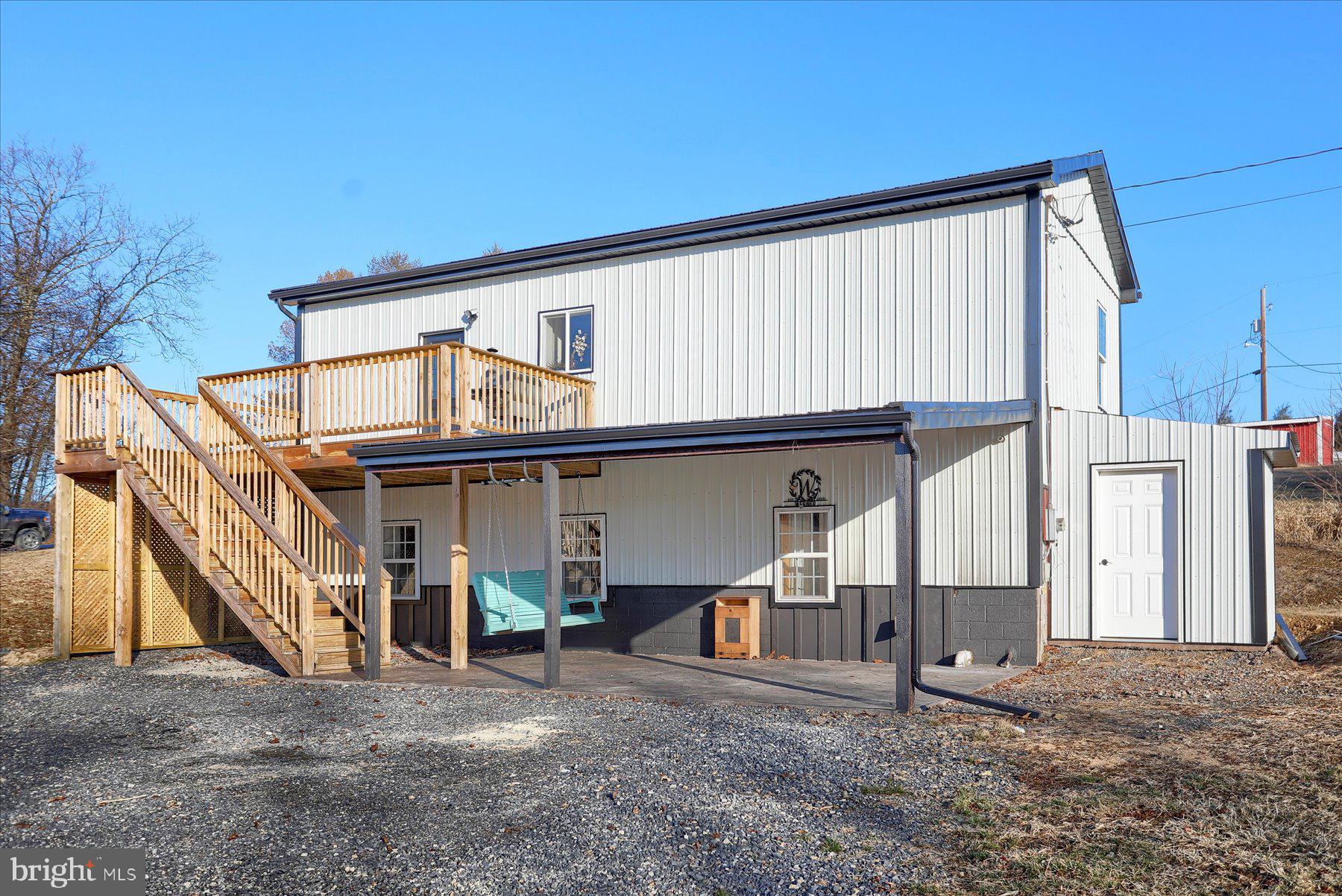 A barn? No........A house, Yes !! A sweet "home" with 3 bedrooms 1 full and 1 half bath. Enjoy your coffee on the deck over looking the fields. Enjoy the summer sunshine with the family on the lower level patio. A great room with vaulted ceilings just makes the kitchen/dining and living room all feel so spacious. And outside storage sheds for added convenience. Fisher Hill is the place to call home !