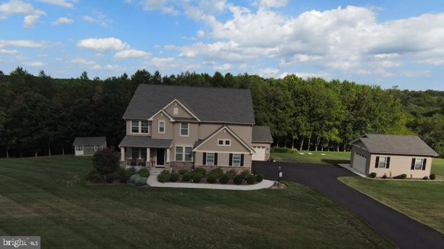 Welcome to this stunning colonial home nestled on 7.6-acres located in the
highly desirable subdivision of Gladhill Estates. With 2 acres of meticulously
maintained landscaping surrounding the home and over 5.5 acres of natural
wooded area complete with scenic private walking trail and peaceful stream
views. This property offers the perfect blend of refined outdoor living and retreat.
As you tour this home, you will quickly see why it is ideal for tranquil living and
entertaining friends and family. The inviting foyer allows easy access to the main
level, which makes for comfortable and enjoyable living. This level features:
formal dining room, pocket door office/possible guest bedroom, grand living room
and open country kitchen with convenient beverage station, huge walk-in pantry,
kitchen island with sink, cabinets, granite countertops, stainless steel appliances
and access to full bath and 3+ car garage. There is access to covered outdoor
living space which also walks down to the fenced back yard.
Upper-level features: large owners suite with walk-in closet, a luxury bathroom
including his and hers sinks, soaking tub, separate shower and large windows for
natural sunlight. Two additional large bedrooms with walk-in closets, hall bath,
separate laundry room and office/flex space overlooking the lower level
completes this space.
The lower level allows for endless possibilities featuring a large recreation room
with surround sound, extra storage, full bath and bonus room, (now being utilized
as an office), and walk out to patio and fenced in backyard. There are multiple
entrances to the backyard oasis.
To finish out this property, there is also a 20’ wide x 24’ deep finished detached
garage with high ceilings for that car enthusiast.
There is no HOA and this home is ready for move-in.