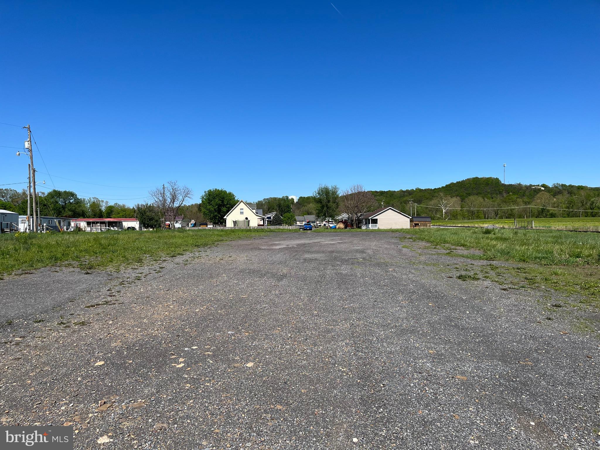 Rare opportunity to own a large track of land within the town limits of Moorefield. Conveniently located, easily accessible, 1.54 acre level lot, partially paved. Zoned Residential. The property is being sold "as is". Agent is related to seller.