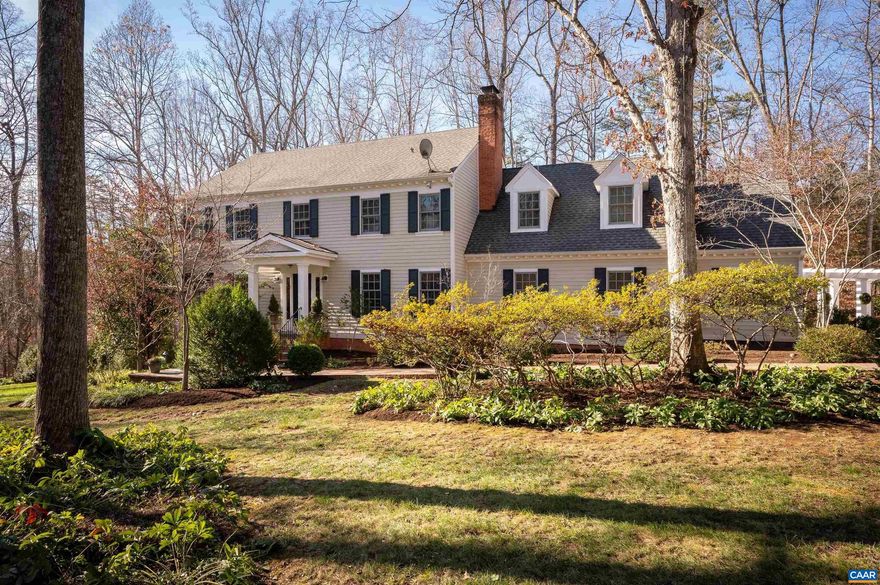 Located off Garth Road in Western Albemarle, this charming family home sits on a generous two-acre parcel, adorned with elegant hardscaping and mature greenery, featuring boxwoods, holly trees, and vibrant perennials. The main house boasts a first-floor primary bedroom suite, complete with custom walk-in closets and a spacious bathroom featuring dual vanities. Upstairs, five additional bedrooms include two with in-suite bathrooms, and a shared full bath. The kitchen, equipped with stainless-steel appliances, connects to a wet bar area for seamless entertaining. The family-style eat-in kitchen flows into the inviting family room, which leads to a charming screened-in porch with a wood-burning fireplace. Additionally, a detached two-car garage includes a delightful one-bedroom apartment with a full bath. Enjoy the incredible location in the WAHS district. Generac home generator installed.,Solid Surface Counter,White Cabinets,Exterior Fireplace,Fireplace in Family Room,Fireplace in Living Room,Fireplace in Rec Room