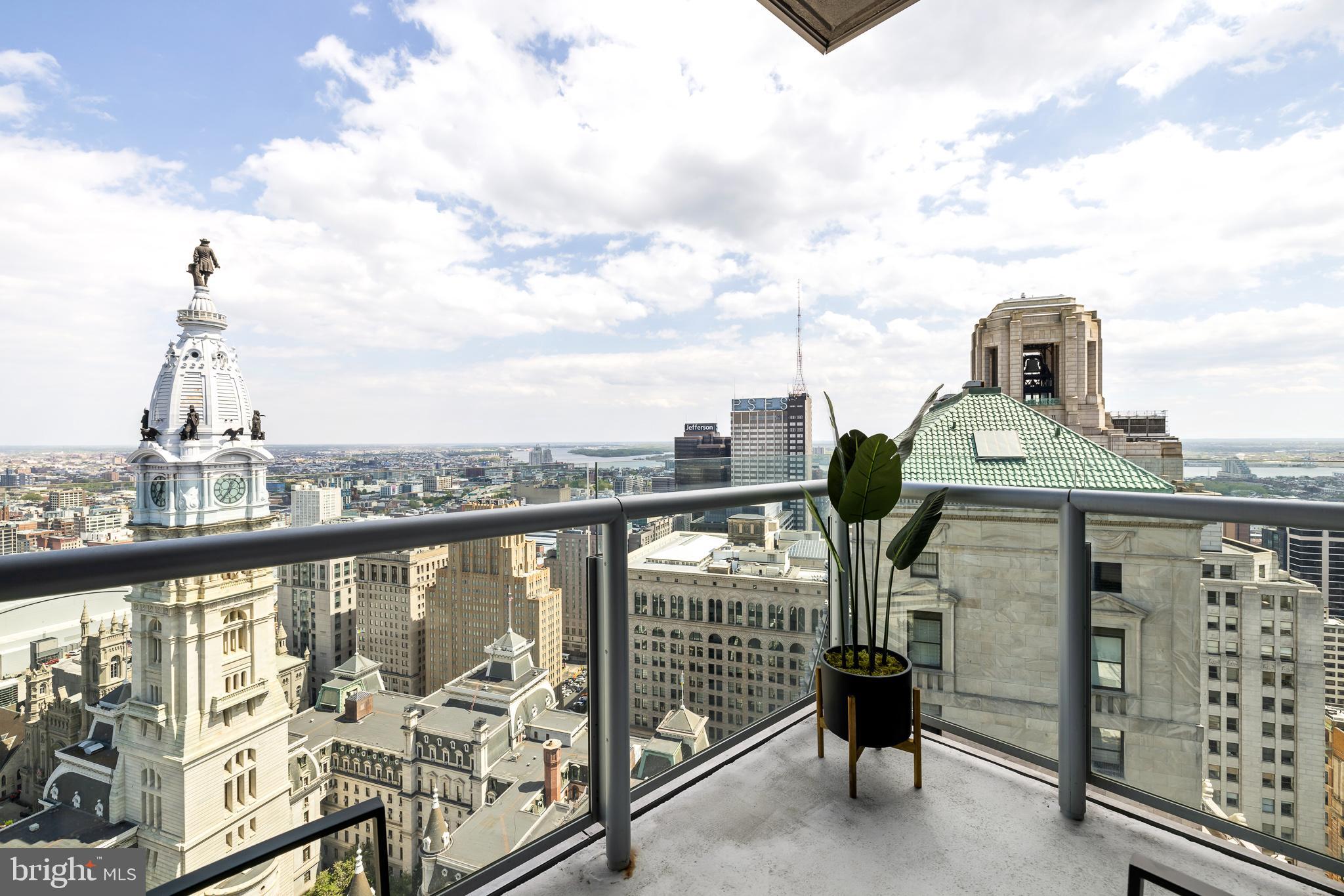 Step into an elevated urban haven, where refinement meets convenience in this prestigious high-rise residence. Offering three bedrooms and three and a half baths across over 2000 square feet of pristine living space, this unit stands alone with its exclusive balcony (only available to B units), commanding breathtaking views of the Iconic City Hall and the city skyline. Floor-to-ceiling windows flood every room with natural light, unveiling panoramic vistas from the Delaware River to the western sunset that redefine city living. Indulge in the pinnacle of modern luxury, with a 10,000+ square foot amenities floor including health club, pool, hot tub, and expansive lounge featuring a plush theater screening room and catering kitchen,. Recent upgrades to this 5 Star building include an outdoor dog park, and newly renovated terrace which will include multiple outdoor grills & dining areas and several outdoor lounge areas with fire-pits and much more. The chef's kitchen boasts Subzero refrigerator, Viking 5-burner gas cooktop, oven, warming drawer, Miele dishwasher, U-Line wine cooler, and more. Valet parking and a dedicated parking space ensure effortless convenience, while Ritz membership privileges offer upgrades and discounts at not only the adjacent Ritz Carlton Hotel but worldwide. With its unrivaled location, impeccable finishes, and unparalleled amenities, this high-rise gem epitomizes urban living at its finest. Welcome to a space where luxury knows no bounds.