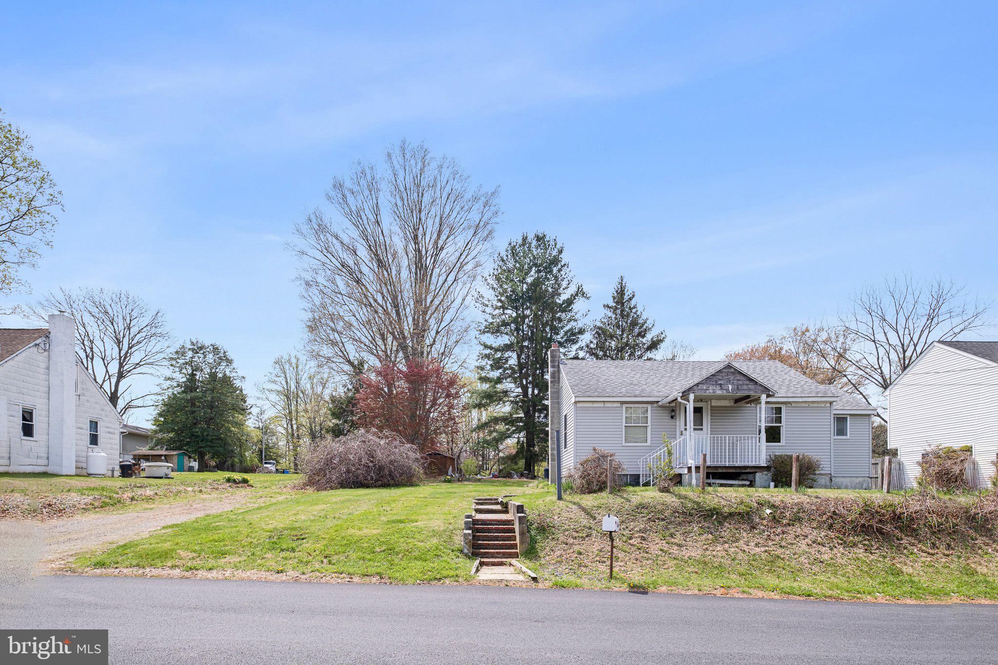 Investor Alert – Prime Opportunity in Garnet Valley School District! Don’t miss this unique chance to restore and reimagine a charming single-story bungalow, ideally situated on just under an acre in the highly desirable Garnet Valley School District. This property includes an additional parcel, offering even more potential for expansion or added value. The home features classic shingle siding and a spacious, open-concept layout that blends the living room and family room for flexible living and entertaining. The kitchen offers a functional footprint, ready for your personal touch. Two generously sized bedrooms boast large closets, and a full hall bath completes the main floor – all on one convenient level. A full, unfinished basement provides endless possibilities for storage, workspace, or future living area. With mature trees and ample privacy, the expansive backyard is a blank canvas for outdoor living, gardening, or even a potential future expansion.
Bring your vision and creativity—this is a rare opportunity to invest in a home with great bones, a sizable lot, and an unbeatable location! Buyer responsible to obtain use and occupancy certificate and any certifications needed for well, septic, roof, etc.