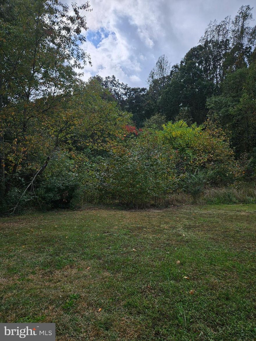 There is a 2 BR conventional septic system in the ground on lot 16. There is a well in the ground on lot 17. Both lots being sold together as one building site. Part open and part wooded.