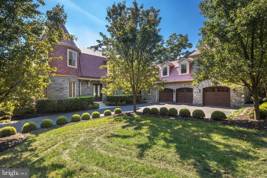 Cherished old Main Line charm, architecture & history are embodied in this wonderful home dating back to the late 1800s. Part of the Lippincott Estate, this house, known as the Annex, was primarily used for grand-scale entertaining. The main home (Alscot) was demolished in the late 1930s & the Annex was utilized as a residence until 2008. The old structure was extensively renovated & expanded with an addition that opened up the floorplan. Current owners finished the huge basement creating approx. 9,874 sf of living space. The stately exterior & stunning custom woodwork are among the classic features retained, enhanced by a new kitchen, family area, laundry room, office, study + master suite. This outstanding property melding the best of yesteryear & today must be seen to be truly appreciated. Expansive lawn surrounds the house accessed by a gated long drive, with mature trees creating privacy & a fully-fenced rear yard. In the awe-inspiring interior, every space is well enjoyed & perfectly suited to its purpose. Ceilings soar on the gracious main level, enriched by wood floors & accents. Double front doors lead to the oversized great room, in the original section of the house, with a stone wood-burning fireplace, library nook, wet bar & opening to the attached porch. Most used is the newer side door/family entrance that opens to the marble foyer, with access to a formal powder room, coat closets, mudroom, 2nd powder room, pantry, rear staircase & heated 3-car garage. A new kitchen is adorned with marble countertops, tons of cabinetry & top-of-the-line appliances, with a sun-filled breakfast room & lovely patio nearby. Relaxing times await in the open family room centered by a gas-burning fireplace, enjoying beaming light from windows on 3 exposures. Five bright, airy bedrooms, including the master and 2 guest suites, are perched on the 2nd floor offering pretty views, distinctive design features, lots of closets & versatile use of space with a huge room including the turret. The vaulted master in the newer wing has a sitting area & private hall with walk-in closets & luxurious his/her baths. A spacious laundry room also occupies this level. The day-lit walkout lower level w/9 + ceilings has a large open recreation space, 2 work areas & storage closets, full bath, sauna, summer kitchen with AGA electric range with double ovens & stacked washer/dryer. A 40 x20  in-ground pool & blissful patio w/wood-burning fireplace complete the oasis.