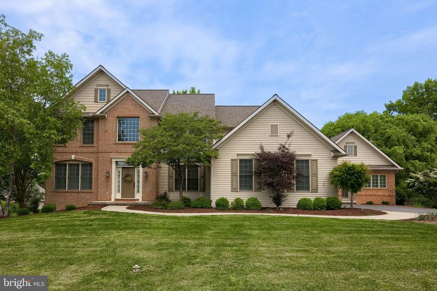 2149 Colleen’s Way, Lancaster, PA 17601 – Kolbacre Ridge | Conestoga Valley SD

Welcome to this gorgeous custom-built home by Charter Homes, ideally situated in the sought-after Kolbacre Ridge neighborhood and Conestoga Valley School District — with no HOA to limit your lifestyle.

Built in 2002 and meticulously maintained, this home offers luxurious living with thoughtful design and multi-generational flexibility.

Step into the impressive 2-story foyer with open staircase and warm hardwood floors that carry through the gourmet kitchen — featuring granite countertops, ceramic tile backsplash, and stainless steel appliances. The main level includes a formal living room, elegant dining room, cozy family room with gas fireplace, and a mud/laundry room for daily convenience.

Upstairs, enjoy a spacious primary suite with a fully remodeled bath: walk-in tile shower, jacuzzi tub, and dual vanities. Three additional nicely sized bedrooms offer plenty of space for family, guests, or office needs.

The finished basement expands your living area with a home theater, office, and a flexible exercise/dance space.

A full one-story in-law suite with private entrance, attached garage, electric fireplace, walk-in shower, and stacked washer/dryer makes this home ideal for extended family or guests.

Outdoors, relax on the 3-tier deck with dual awnings, overlooking a beautifully landscaped .55-acre lot with mature shade trees and a peaceful garden path.

Additional features include a 3-car garage plus lower-level equipment garage, plantation shutters, and top-of-the-line air and water systems to keep your family healthy and comfortable.

This stunning, flexible home offers luxury, privacy, and freedom — all in a prime Lancaster location!