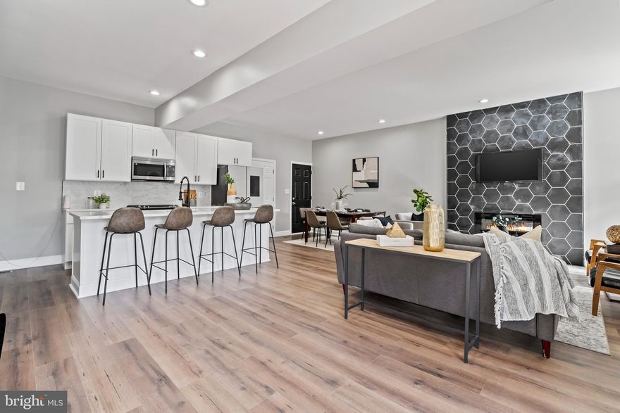 $10K Vacant to Value Grant, $10K (CDBG) Grant, $8750 BorrowSmart Program, $7.5K Go Northwest grant, 3% Truist Bank Grant, $5k Buying into Baltimore Grant, Up to $19,5K LNYW, 3 levels of Luxury best describe this Charming porch front home that features 5-bedroom 3-Bathroom w/ 1st and 2nd-floor master suites, High-end fixtures & an open floor plan. Chefs Kitchen Featuring stainless steel appliances, Quartz Countertops, 5 Burner Stove w/ over-the-range microwave, & custom backsplash.  New Electric, Plumbing, & HVAC w/ all approved permits.  Close to Golf Course, Shopping Mall, Baltimore Zoo, SSA, Parks i695 i83 & i70. Luxury Living at Affordable Pricing! Upon completion of Baltimore City homeownership counseling, the Buyer may be eligible for all or some grants and down payment assistance programs listed above but would need to check with their lender for qualification.