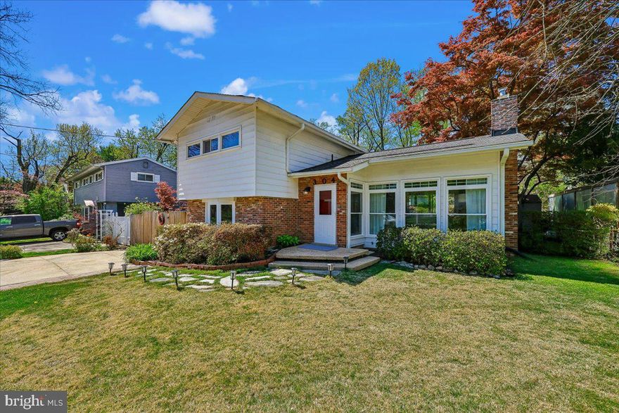 In the established and highly desirable Twinbrook Forest neighborhood, this thoughtfully updated split-level home offers a compelling blend of classic character and meaningful modern upgrades. Originally built in 1956 and meticulously maintained, the property reflects over $170,000 in improvements that enhance both livability and long-term reliability .

The interior opens to a bright, connected main level where the living room, dining area, and kitchen flow naturally for everyday living and entertaining. Hardwood floors, recessed lighting, and abundant natural light create a warm, cohesive environment. The living room features a fireplace with glass doors and bay windows that anchor the space with both charm and function.  The kitchen has been significantly upgraded with quartzite countertops, updated cabinetry finishes, under-cabinet lighting, tile backsplash, and modern appliances including a recently replaced refrigerator and stove. The result is a clean, durable, and highly functional workspace suited to both daily use and hosting.

Recent improvements extend well beyond cosmetic updates. Major system upgrades include a new roof and decking, all replacement windows, updated gutter system, chimney repointing with new cap, and a fully replaced main sewer line from the house to the street. Basement waterproofing with French drains provides added protection and peace of mind.

The lower level has been fully finished, adding flexible living space ideal for recreation, work-from-home, or guest use. A newly added en suite bath and renovated hall bath introduce modern design and convenience, bringing the home in line with current buyer expectations.  Additional features include central vacuum, updated washer and dryer, and a Level 2 EV charging station. Outdoor living is equally appealing, with a patio for entertaining, a well-maintained yard, and a storage shed. Plenty of street parking is available, and there is off-street parking for three cars in a concrete driveway.