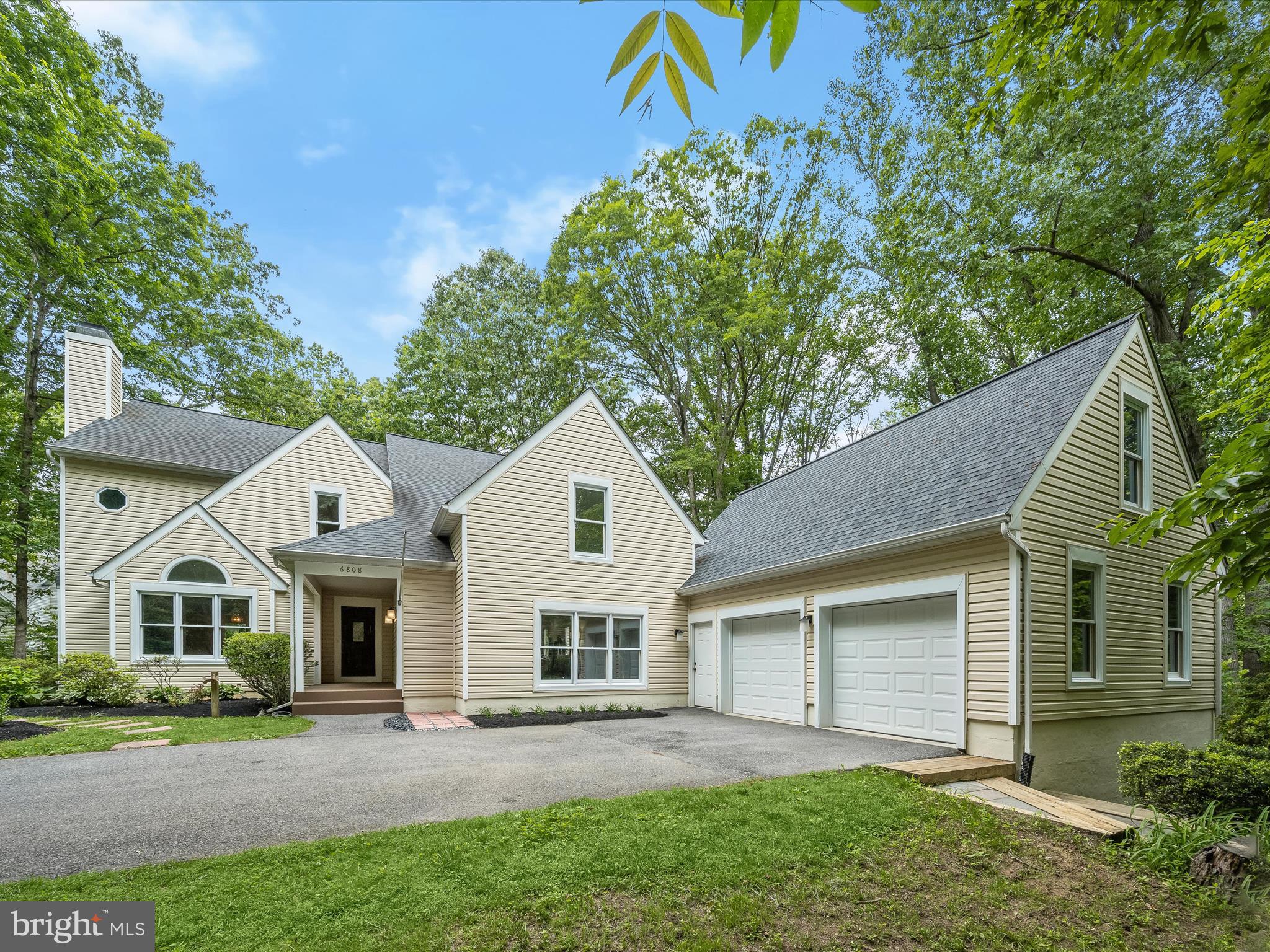 Tucked away on a quiet wooded cul-de-sac, this beautifully updated colonial offers the perfect blend of privacy, elegance, and modern comfort. A dramatic two-story foyer welcomes you with gleaming hardwood floors, a stunning globe chandelier, and an oak staircase with matching handrail. Formal living and dining rooms feature classic accent molding and a wood-burning fireplace with marble surround, ideal for stylish entertaining. The gourmet kitchen is a chef’s delight, boasting granite countertops, wood cabinetry, a center island, stainless steel appliances, and a cozy breakfast nook. The adjacent family room includes a second wood-burning fireplace and opens to a large deck with steps leading down to an open-concept library/home office with built-in bookcases. A powder room and laundry room complete the main level. Upstairs, brand-new carpeting runs throughout all bedrooms and the hallway. The spacious primary suite is a true retreat, offering vaulted ceilings, a wood-burning fireplace, and private balcony, a sitting room with, an expansive closet, and a luxurious remodeled en suite bath with a jetted tub beneath a skylight, dual granite vanities, and a frameless glass shower. Three additional bedrooms sharing a beautifully updated hall bath and a fourth bedroom suite with its own full bath complete the upper level. The walkout lower level is ideal for guests or multi-generational living, featuring a bedroom, full bathroom, a bonus room, large living area, ample storage, and walkout access to the patio and wooded yard.
Surrounded by lush landscaping, fish pond, and expansive wraparound decking, this home is a private oasis. Major updates include: Roof (2019) Siding, kitchen, and baths (2017), HVAC, dishwasher, skylight glass, Brand-new cooktop, garage doors, carpet, and fresh interior paint, Newly added patio. Enjoy the best of both worlds—secluded wooded living with easy access to all the shopping, dining, entertainment, and commuter routes that vibrant Columbia has to offer.