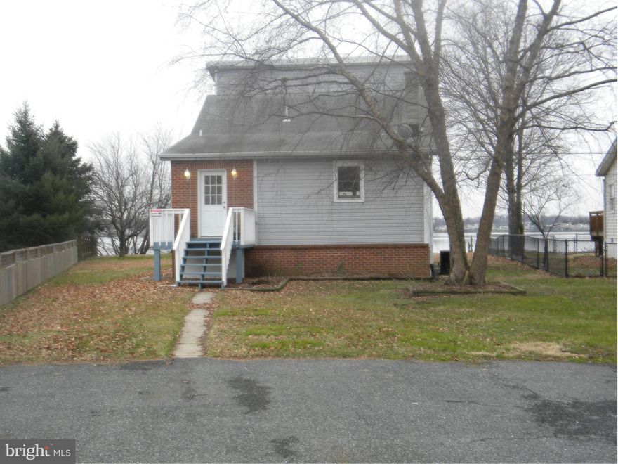 Breath taken. Is this a resort suite or just an escape into paradise? Water front, access, view, Detached 3 bedrooms two on the main level an upper level master bedroom with full bath embracing the sunrise and sunset framed in your huge water view window. Main level water view bursting onto the huge deck with a Private pier, Kitchen granite counters, cabinets, ceramic tile wooden floors full Bsmnt