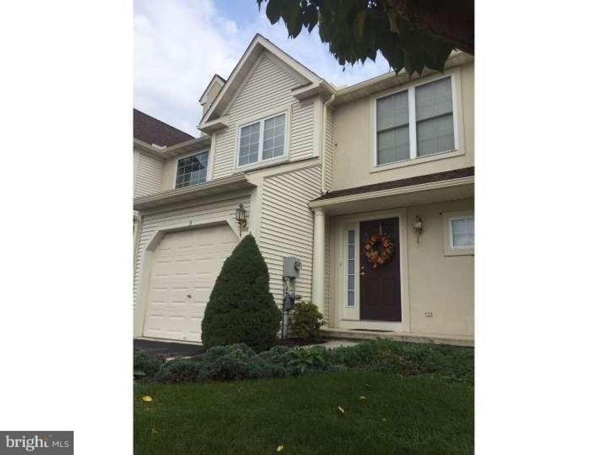 Why pay rent when you can own this beauty? Deerfield Village is the perfect townhouse community. Never worry about snow removal or lawn care again. Just live and enjoy! Oh, and there's so much to love here. This rarely available model is nestled in the rear of the subdivision next to a lovely treeline. Step inside and know you're home. The place is immaculate with fresh, neutral paint, lush wall-to-wall carpeting, staggered kitchen cabinetry, a vaulted ceiling in the master bedroom, a cozy gas fireplace, plus an unfinished, full daylight lower level that would make another wonderful living space.