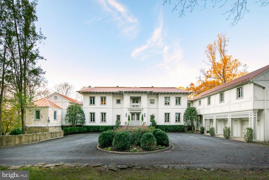 Stone pillars and a beautiful tree lined drive lead to this exquisite country estate of uncompromising quality and extraordinary design. Perfectly sited on 18 gorgeous acres of flowering trees and lush woodlands, this stately residence offers over 7,581 square feet of spectacular living space. Just minutes from the charming villages of historic Middleburg and Upperville,  “Woodmont” is completely private and secluded.  Fine shops, wonderful restaurants, excellent schools and sporting clubs are all nearby. Located in the prestigious “Orange County Hunt Territory”, “Woodmont” is the centerpiece of the equestrian and wine country community. Nature and hiking trails surround the property, creating a serene and peaceful setting, and an escape from the hectic city life of D.C. Upon approaching the wide stone staircase, the elegance and sophistication of the front façade is impressive.   The entry foyer and grand hall set the stage for a beautiful interior of charm and classic design. The ceilings are high, the woodworking is superbly finished, the wood flooring is gleaming and polished. The rooms are spacious and open, and beautiful new casement windows are a replica of the gracious old, treasured manors of earlier times. Completely renovated by a Master Designer/craftsman, the historic details are carefully blended with all the modern amenities of today’s lifestyle. The gourmet country kitchen is a true Chef’s delight, with premium appliances and imported stone countertops. The cabinetry is all custom made with re-claimed antique wood pieces added to authenticate the passage of years. Open to the dining and living areas, gracious entertaining is ideal for all occasions, large or small, for intimate family groups or spectacular Holiday parties. Charming French doors lead to a stunning rear terrace, overlooking the glistening free form pool. The second level boasts 4 incredible Bedrooms and 6 ½ baths, all of which are completely re-done by a noted interior designer and published in the” Virginia Living Magazine”. The Primary Suite is absolutely amazing and luxurious beyond description. Above the three- bay garage is a huge, finished room for multiple uses: a studio, a dorm room for kids and friends, an au pair suite, or a guest apartment. There is another full Bath and separate access for privacy in this wing. The grounds are professionally landscaped with brilliant perennial gardens and a circular drive for accommodating visitors. Stone terraces and wrought iron gates enhance this story book setting. “Woodmont” is an extraordinary country estate that represents one of the finest in all of the renowned Virginia Wine and Hunt Country.  Washington Dulles International Airport is approximately 40 minutes away and the Nation’s Capital is within easy access.
Highlights of Woodmont: Located in the prestigious Orange County /Includes 5  Bedrooms, 6 full Baths, 1 half Bath / Standing seam metal roof / Free form Gunite heated Pool surrounded by stone terraces / Imported stone/marble countertops / Stunning new casement windows / Designer brass light fixtures throughout / High ceilings, transom windows / Three wood-burning fireplaces / Refinished hardwood flooring / Multiple glass paned French doors / Rear terraces of beautiful stone / New state-of-the-art appliances / Wrought iron gates lead to rear woodland gardens and a cutting garden / Brilliant crystal chandeliers / Gorgeous professional landscaping throughout the property / Whole house backup Generator / Two Wells