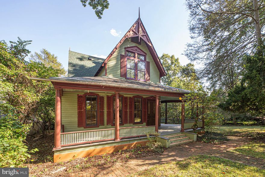 Live in your vacation home year round!   Lovingly enhanced by the current owner, this 1895 Victorian is ready  for you to bring it up to the next level. The skylit kitchen with a soaring wooden ceiling, exposed beams, custom cabinetry, period light fixtures and a table space and seating area was reworked and expanded in 2002.  The main floor offers lots of flexible space.  A living room, dining room and first floor bedroom.  The custom main level full bath, also done in 2002, was ahead of its time.   The original heart pine floors, custom moldings, wood and bead board ceilings,  a lot of leaded and stained glass, custom radiator covers, lots of interesting built-ins,  and period light fixtures through out make this one special.  Upstairs are  four bedrooms including a big room that faces out on the avenue.  The huge wrap around porch that fronts on the Avenue is a  perfect place to have dinner, of just lounge around and watch the world go by.  On almost 1/3 of an acre, there is plenty of yard.  The house is classic and ready for its next update.  With 100+ acres of forest preserve and parkland including tennis courts, baseball fields, playgrounds, a dog park and a private swimming lake in the woods, Washington Grove is an oasis. Come live where there are lots of town events and traditions and community spirit abounds. Conveniently located within walking distance of the MARC train. The Shady Grove Metro, I-270, and the ICC are also nearby.