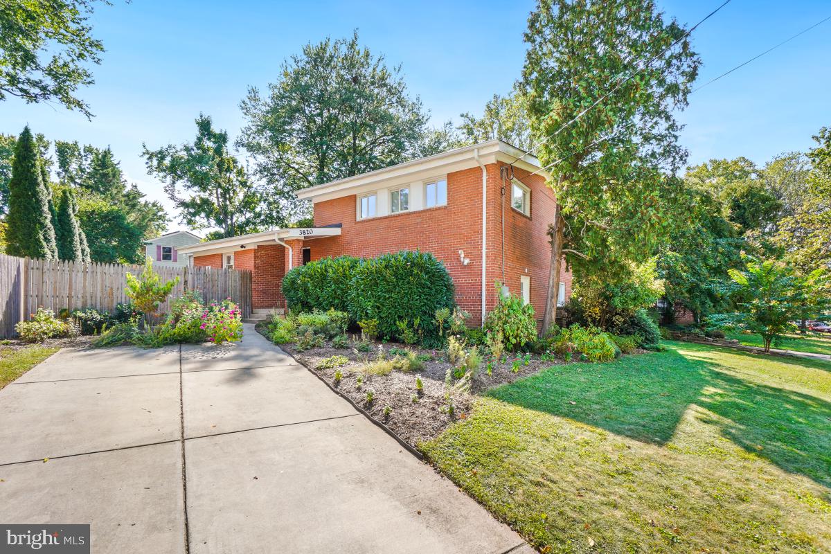 Pictures coming Wednesday afternoon... Welcome Home to this fantastic full brick 3 level split home in Popular Rock Creek Palisades. With 3 spacious bedrooms and 2.5 full baths and roughly 2,000 square feet of finished living area you will be impressed by the superb quality living experience this home affords. As you approach the home you will see that it is nestled amongst pretty perennial flowers, shrubbery and trees with a lovely covered front porch. Enter into the main living level and be Wow’ed by the inviting vaulted ceilings, gleaming hardwood floors and a welcoming light-filled and open concept floor plan. The kitchen is a chef’s dream; updated with sleek cabinetry, beautiful stone countertops and newer appliances. The large living room is perfect for entertaining with a gas fireplace neighboring a wall of windows and easy flow into the ample dining area and kitchen. Adjacent is a cozy den addition that leads to the back deck and picturesque back yard. Head upstairs and find a generous primary suite with a renovated primary bath that features fantastic built-in cabinetry, vanity, shower and luxury vinyl tile. Two additional bedrooms and an updated shared full bath grace this level. Downstairs is a huge daylight walkout family room with a sliding glass door that exits to the side yard. This space is even ample enough to accommodate a fourth bedroom if desired. A convenient modern half bath and unfinished utility room with laundry, doorway to the front yard and a work bench finish this level. The back yard is delightful with its abundant gardens and lots of space to run and play. It boasts a slate side patio, back deck, shed and is fully fenced. Bonuses of the home include: New door hardware, custom window treatments, ceiling fans and many lighting/electrical improvements. Additionally, the roof, gutters, downspouts, HVAC & water heater were all replaced in 2017. Only One block to Rock View Elementary & the Ride-On bus, and a short walk to Rock Creek Park's hiking & biking trails. Super convenient location close to commuter routes and transportation and lots of shopping and restaurants nearby as well as the fun Town of Kensington. This home is an ABSOLUTE MUST SEE!