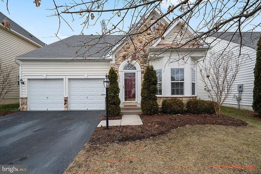 This lovely home is located in the 55+ community of Dunbarton**Dunbarton is located within the Braemar subdivision** There is a security gate which is closed in the evening.  This stone front home was built by Patriot Homes.  The seller of this home has completed very extensive renovation. All new hardwood flooring on the main level except the newly replaced carpet in the 2 main level bedrooms and the tile in the two main level baths.  The kitchen has new stainless appliances--stove; microwave; refrigerator with ice maker; dishwasher. Hardwood floors. Corian counters with Corian sink.  The upper level has a large loft with a large closet, and full bath. Perfect for an office or a guest bedroom. More photos to follow