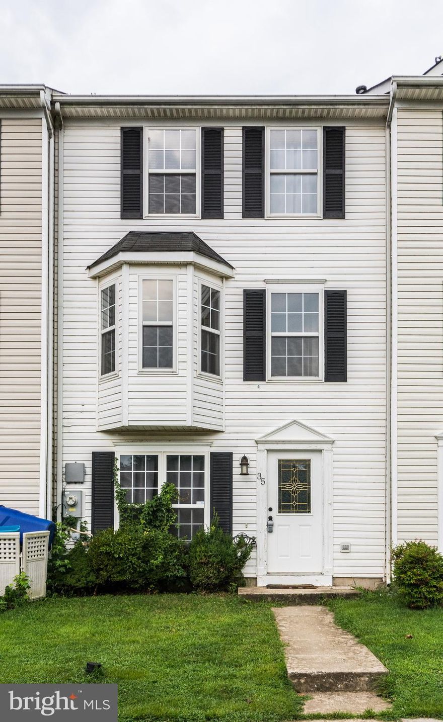 Spacious three-level townhome located in Greenbriar at White Marsh featuring 3 bedrooms and 2.5 baths with a ceramic tile entryway, family room with fireplace and bright home office or 4th bedroom on the main level. Country kitchen with gas stove, plenty of counter space, table space and pantry with sliders to deck with fenced yard. Bright living room with half guest bath. Master bedroom with his and hers closets and full private bathroom. Two additional bedrooms and extra full bathroom finish off the upper level. Neutral tones throughout and no HOA!