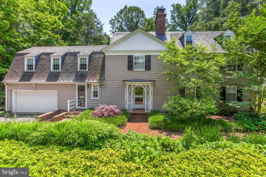 Designed by noted Baltimore architects Palmer & Lamdin in the 1930s and later enhanced by landscape architectural design by Oehme, van Sweden, thoughtful details abound at this private Poplar Hill residence. From the brick herringbone patterned front walk to the renovated Delbert Adams cooks' kitchen to the large bluestone patio, 5601 Waycrest lends itself equally well to comfortable family living and elegant entertaining.   A neutral palette and wood floors throughout make inside as soothing as the concrete and stone falling water fountain does outside. Spacious living and dining rooms feature multi-paned bay windows and access to the brick floored screened porch. In addition to a large primary bedroom with en suite bath, walk-in closets and access to a screened porch aerie, the second floor offers two or three additional bedrooms and two additional full baths.   The natural light-filled third floor provides flexibility for additional bedroom, office or studio space.   25 new double-hung Pella windows, ample closet space, built-in cabinetry, zoned air-conditioning and  a two car garage with automatic opener help makes this special home easy to live in.  Quietly elegant, rarely available and thoroughly captivating, this home will please the most discriminating buyers.
