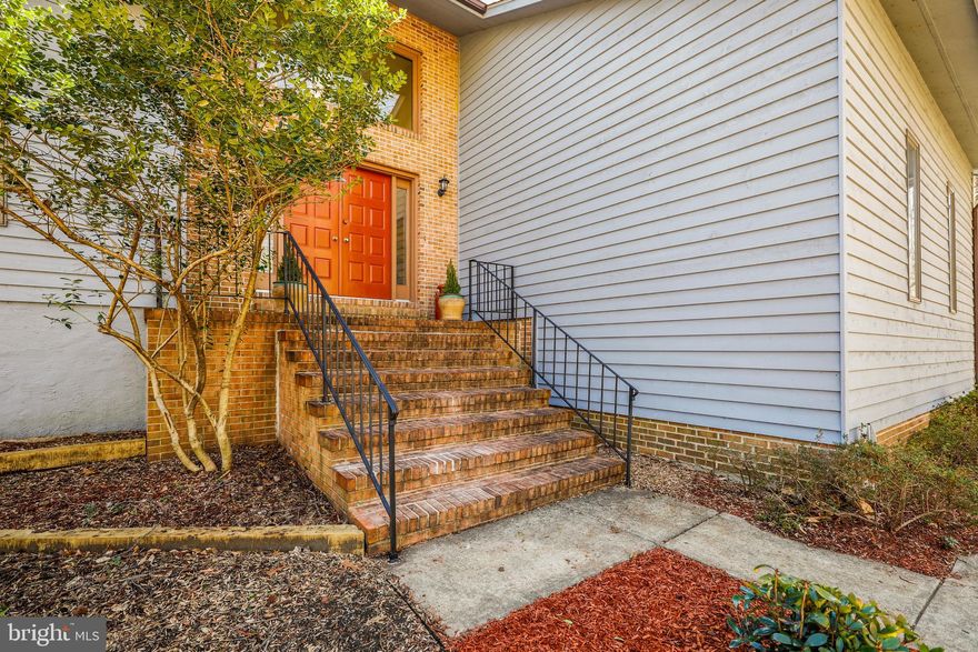 Nestled amongst the trees sits a Beautiful Contemporary Home in a water privileged community. Lots of natural light streams throughout this 4 bedroom, 3 1/2 hath home with 512sf 2 car garage. Extended Driveway Offers Plenty of Additional Parking. Living Rm and Dining Rm are surrounded by hardwood floors. Kitchen offers granite counters, back splash, under cabinet lighting & new appliances. Family room with wood burning brick fireplace. Sunroom near kitchen with entrance to deck and patio.  Fully finished basement (1,712sf) with full bath, possible 5th bedroom with egress and room for pool table and family entertaining. Roof and skylights only 5 years old. Palisades on the Severn is a non mandatory HOA. f you would like to join, the fee is $95.00 per year. The community offers a private beach, pavilion and boat ramp. Transferable Pool Bond for Old Mill Swim Club. The transfer fee is $10.00 and $335.00 per season. Old Mill Swim Club also has a swim team.