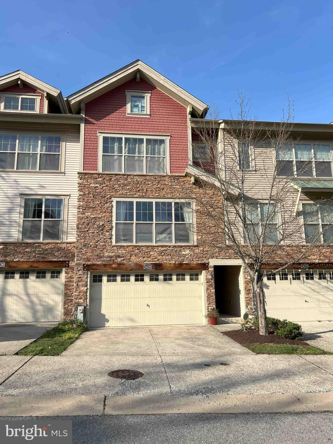 Welcome to this four-level Silver Spring townhome with three levels of solid hardwood, situated in a secluded complex next to the woods with easy commute to both Baltimore and DC. The ground floor features a private office/storage space, coat room, and two-car garage. The second floor consists of a dining area, a sunlit living room with coffered ceiling and stone fireplace, as well as a gourmet kitchen with granite countertops, stainless-steel appliances and modern cabinetry. Off the kitchen is a deck perfect for grilling and summer entertaining. Upstairs, you will find the master suite with vaulted ceiling, two walk-in closets and en suite. Two additional bedrooms, a hall bathroom and laundry complete the third level. The fourth floor is a private suite with a full bathroom—ideal as a fourth bedroom, second office, or a guest suite. Within walking distance is Fairland Park, Edgewood neighborhood park, Briggs Chaney Park-and-Ride with bus rapid transit, East County Community Center, and Briggs Chaney marketplace. You also have access to biking trails, tot lots, and a peaceful setting just minutes from major routes like ICC-200, I-95, and US-29, making commuting a breeze to Silver Spring, DC, Rockville, and Baltimore. Don’t miss this spacious and versatile townhome—schedule your showing today!