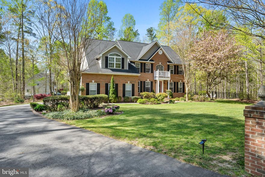 Welcome to this stunning brick-front colonial offering over 4,600 finished square feet of beautifully designed living space, nestled on a one acre cul-de-sac lot in desirable Northern Calvert County.  Inside, this home boasts a gourmet kitchen that features a large breakfast bar, granite countertops, sleek appliances, an abundance of cabinet space and a pantry, opening into a spacious family room with a cozy gas fireplace.  The main level also includes a formal living and dining room as well as a professional office.   Step outside from the bright and airy morning room, to your private backyard oasis, complete with an inground swimming pool, elegant paver patios and walkways and a lush, meticulously maintained yard enhanced by professional landscaping.  Upstairs you will find an owner's suite with vaulted ceilings, a sitting area, a walk-in closet and a luxury bathroom with a walk-in shower and separate soaking tub.  Additionally, three more secondary bedrooms share a well appointed hall bathroom, providing plenty of space for family and guests.  The fully finished basement offers a spacious recreation room with a wet bar, an exercise room or den and a full bathroom - perfect for both entertaining and everyday living.  Located in highly rated school districts, this home combines luxury, comfort and convenience for the ideal family lifestyle.